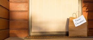 Food delivery in paper bag at door of home for self isolation banner coronavirus recovery