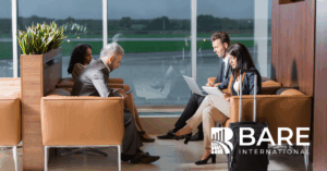 Business Travelers Working in Airport Lounge – BARE International